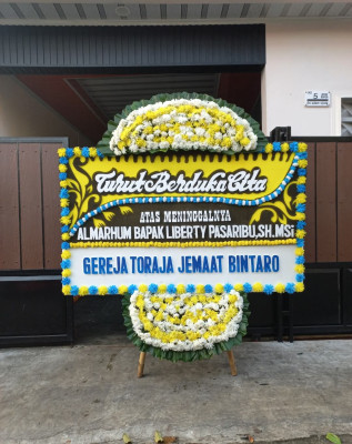 Papan Bunga Duka di Amen